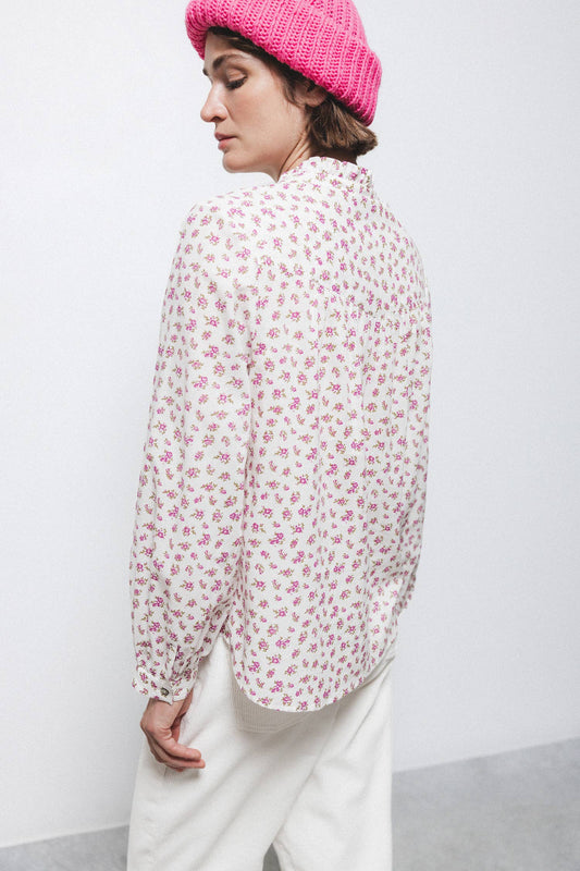Blusa floreale con volant e bottoni