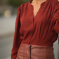 Blusa tinta unita con pieghe