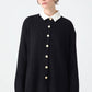 Cardigan lungo nero con bottoni dorati e colletto a contrasto