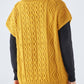 Gilet in maglia a trecce con scollo a V