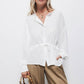 Blusa bianca con coulisse in vita