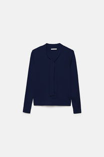 Maglione in maglia rasata con fiocco e scollo a V