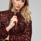 Blouson con paillettes color vino