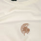 T-shirt donna pigmentata crop in cotone organico con stampa palma