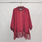 Poncho in maglia con frange e zip, maniche a pipistrello