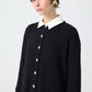 Cardigan lungo nero con bottoni dorati e colletto a contrasto