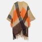 Poncho a quadri con frange