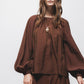 Blusa effetto stropicciato con maniche a palloncino
