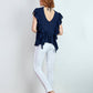 Blusa fluida con volant e schiena a V