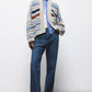 Cardigan a righe con maniche a palloncino