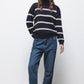Maglione a righe in maglia con collo alto