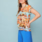 Camicia pareo multicolor con scollo a barca e bottoni sul retro