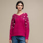 Maglione in maglia con paillettes sulle maniche
