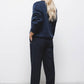 Pantaloni sartoriali essenziali con tasche oblique
