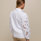 Blusa in cotone con maniche ricamate