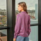 Blusa geometrica con colletto e maniche lunghe