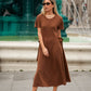 Abito midi in maglia con fiocchi laterali