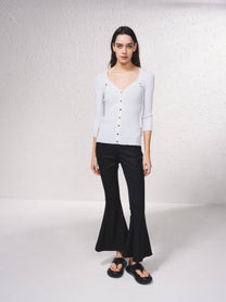 Cardigan in maglia a coste con catene dorate