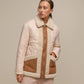 Giacca trapuntata bicolor con profili teddy e zip