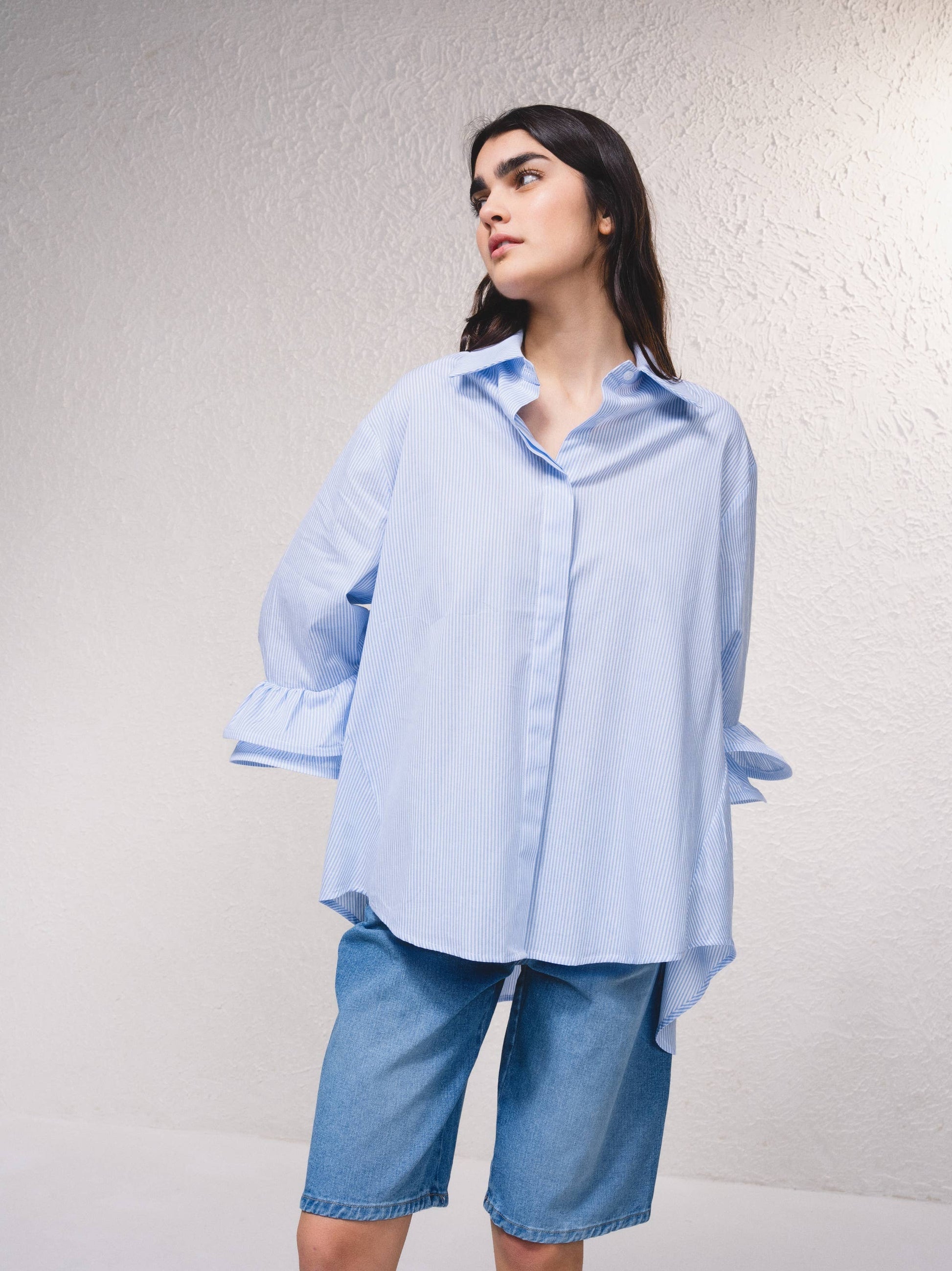 Blusa a righe con volant rinforzati