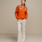 Maglione in maglia con paillettes sulle maniche