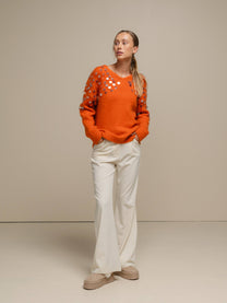 Maglione in maglia con paillettes sulle maniche