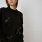 Maglione in maglia con fiocchi