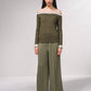 Maglione off-shoulder in lurex con profili a contrasto