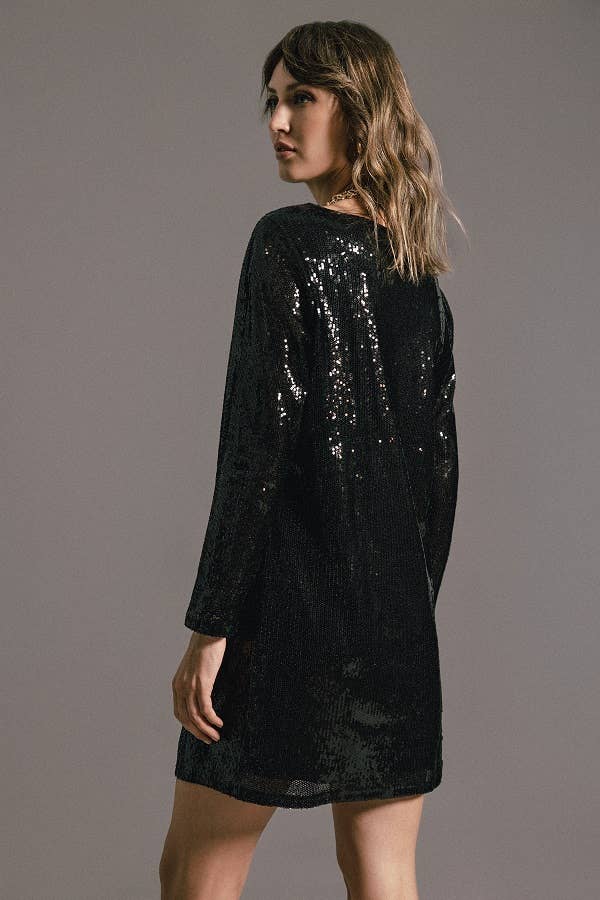 Abito nero con paillettes e maniche a tre quarti
