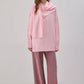 Maglione in maglia rosa con sciarpa integrata