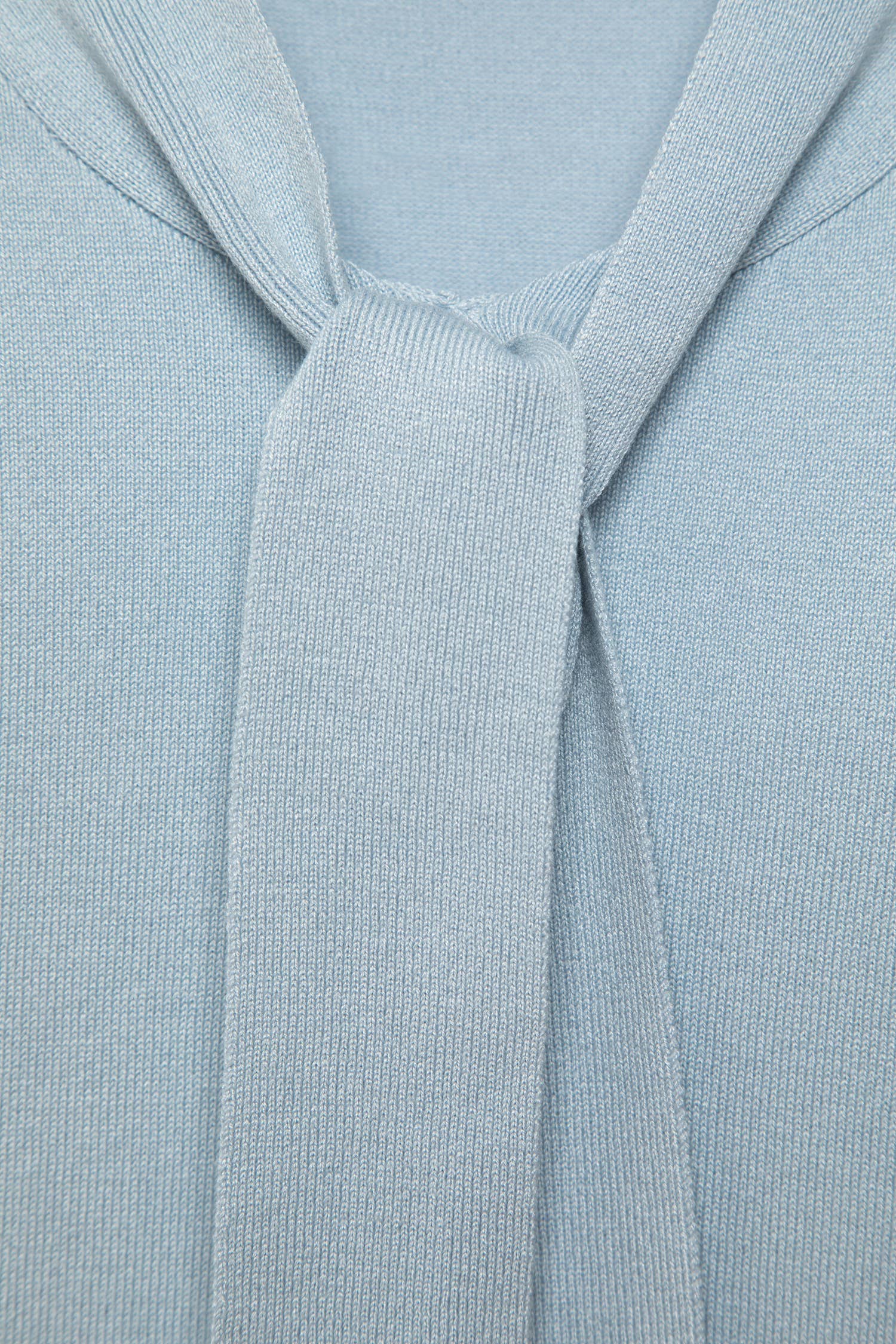 Maglione in maglia rasata con fiocco e scollo a V