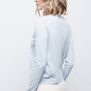 Maglione in maglia rasata con fiocco e scollo a V