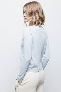 Maglione in maglia rasata con fiocco e scollo a V