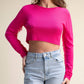 Top corto in maglia con frange sulle maniche