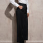 Pantaloni eleganti fluidi a gamba ampia gessati neri