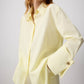 Camicia in popeline giallo burro con polsini oversize
