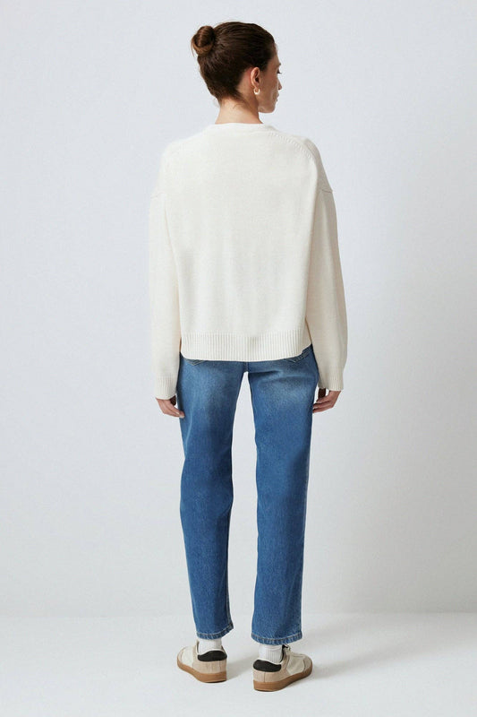 Cardigan in maglia crema con tasche e bottoni