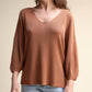 Maglione in cotone con scollo a V e maniche voluminose