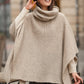 Poncho in maglia con collo alto