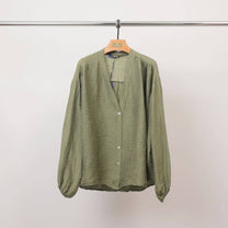 Blusa testurizzata con bottoni e scollo a V