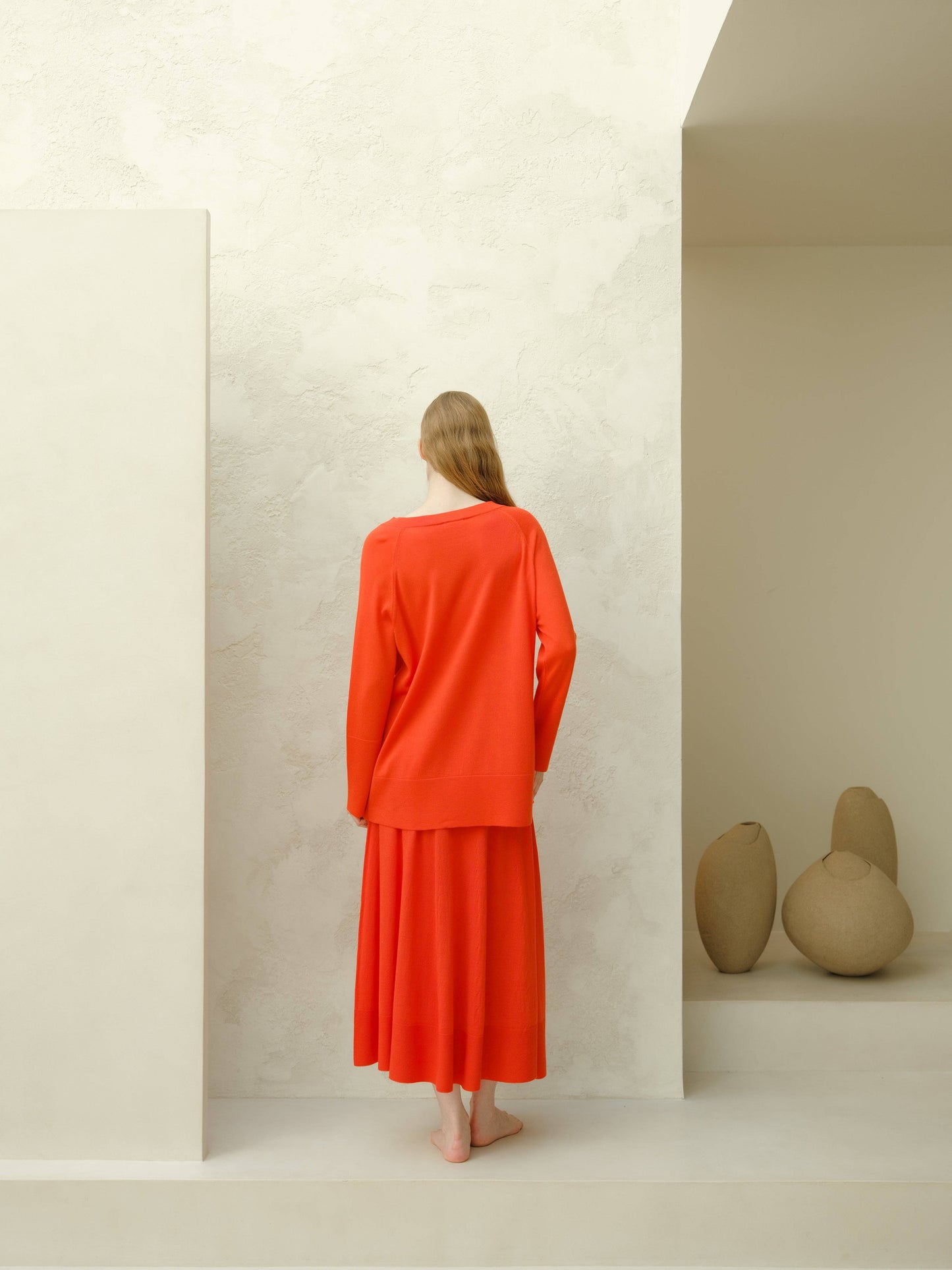 Maxi maglione in lana merino extra fine con scollo a V