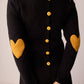 Maglione nero con toppe a cuore e bottoni sul retro