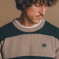 Maglione Sella a righe in lana merino verde pino e marrone