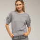Body in maglia monospalla con volant a pois