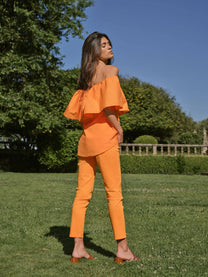 Top off-shoulder con volant in popeline