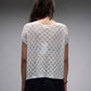Top corto in crochet traforato dal fit ampio