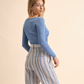 Top a maniche lunghe con scollo quadrato