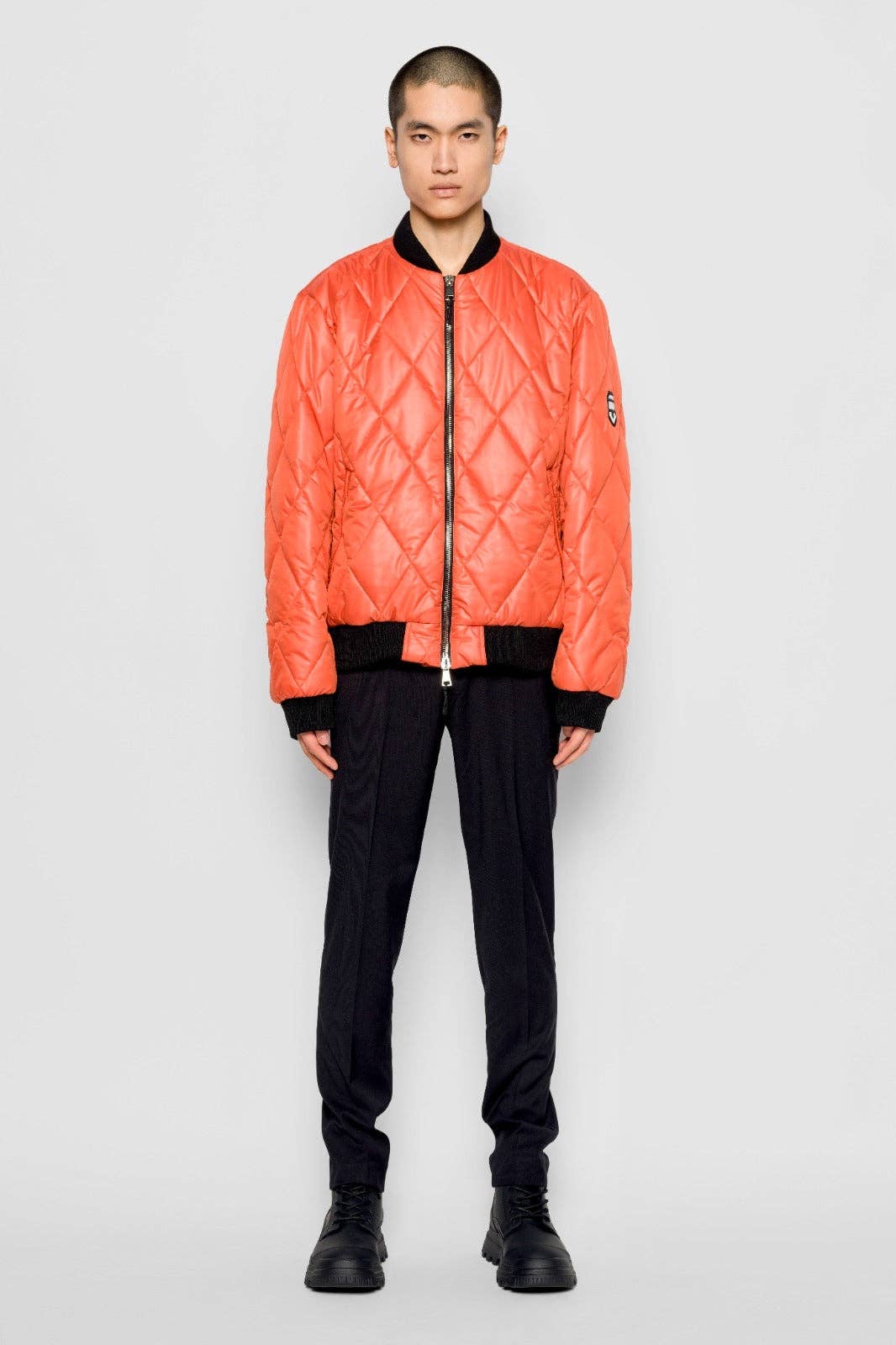 Bomber trapuntato a rombi arancione con zip