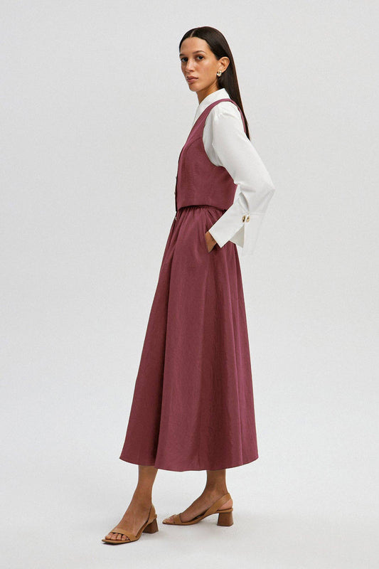 Set gilet e gonna midi in cupro rosa