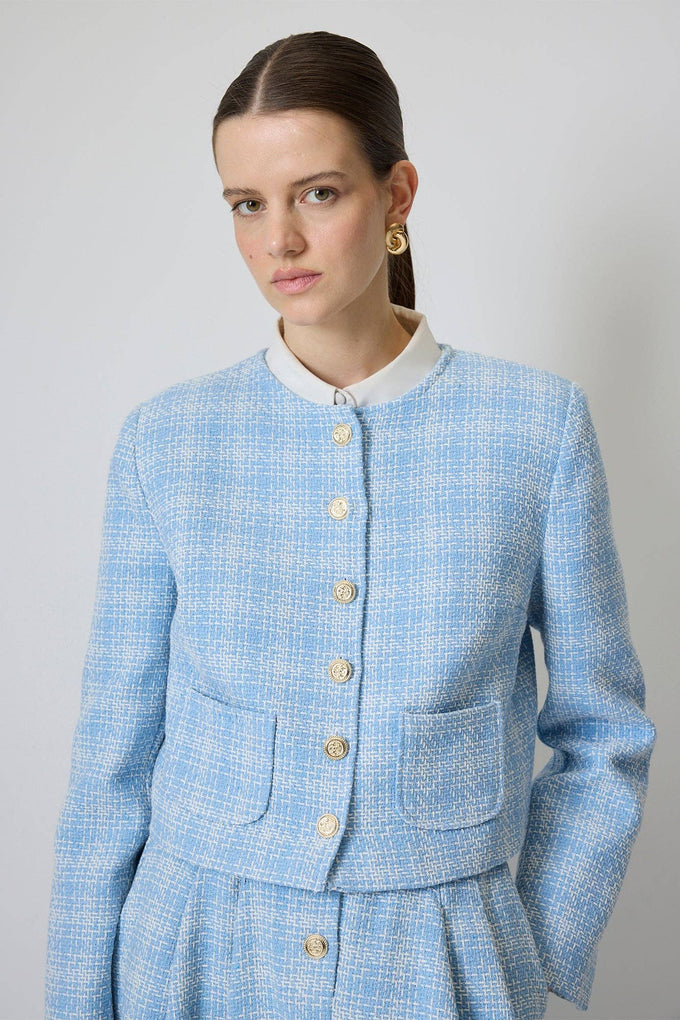 Completo in tweed di cotone con giacca corta e gonna midi